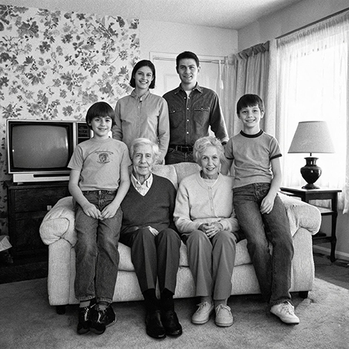 Black and white family gathering photo from the 1990s